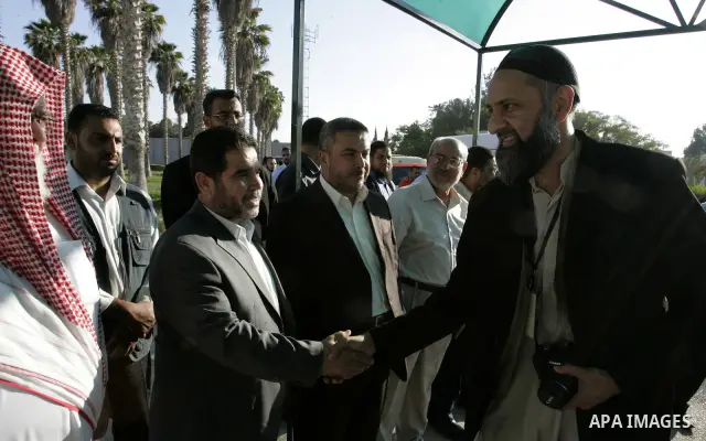 Activists from the "Miles of Smiles 3" charity are welcomed by locals after crossing with medical aid into Gaza through the Rafah crossing Egypt on June 19, 2011. The convoy, carrying medical aid for the impoverished Pal...