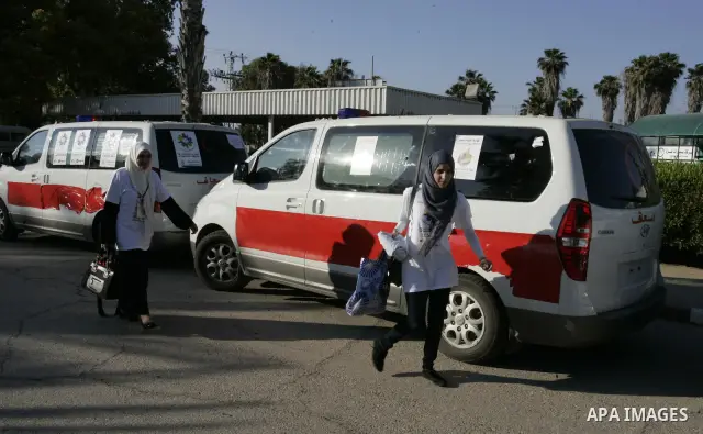 A convoy of "Miles of Smiles 3" carrying medical aid to Gaza crosses the Rafah crossing into the southern Gaza Strip from Egypt on June 19, 2011. The convoy, carrying medical aid for the impoverished Palestinian territor...