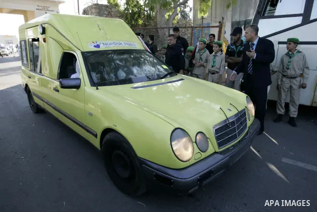 A convoy of "Miles of Smiles 3" carrying medical aid to Gaza crosses the Rafah crossing into the southern Gaza Strip from Egypt on June 19, 2011. The convoy, carrying medical aid for the impoverished Palestinian territor...