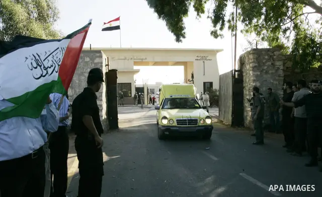 A convoy of "Miles of Smiles 3" carrying medical aid to Gaza crosses the Rafah crossing into the southern Gaza Strip from Egypt on June 19, 2011. The convoy, carrying medical aid for the impoverished Palestinian territor...