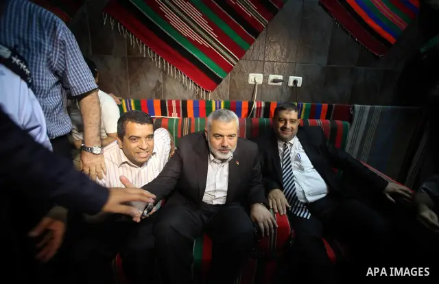 Palestinian Prime Minister in Gaza, Ismail Haniya inspect clothing stores during the opening ceremony of Al-Shuhada Street in Gaza City on June 19, 2011. Photo by Ali Jadallah