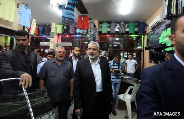 Palestinian Prime Minister in Gaza, Ismail Haniya inspect clothing stores during the opening ceremony of Al-Shuhada Street in Gaza City on June 19, 2011. Photo by Ali Jadallah