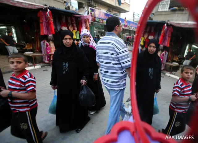 A Palestinian women walks in the Jabaliya refugee camp market in the northern area of the Gaza Strip on June 20, 2011. Reports state that the Islamic militant group Hamas is weighing a new strategy of not directly partic...