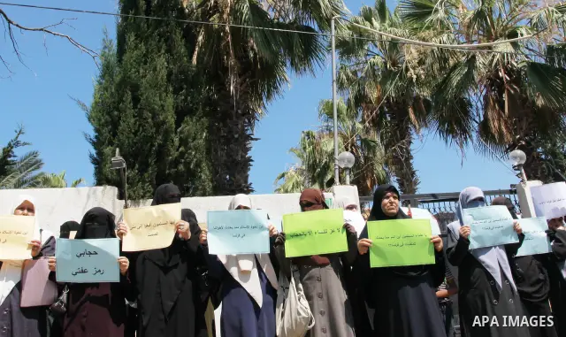 Palestinian women supporters of the Islamist movement Hamas demonstrate against the introduction of a ban on the wearing of veils in France, on June 20, 2011 in front of the French Cultural Center in Gaza City. Photo by...