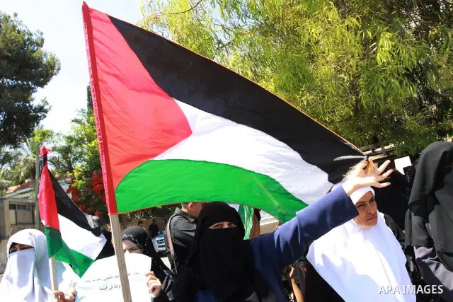 Palestinian women supporters of the Islamist movement Hamas demonstrate against the introduction of a ban on the wearing of veils in France, on June 20, 2011 in front of the French Cultural Center in Gaza City. Photo by...
