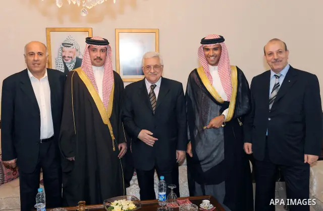 Palestinian President Mahmoud Abbas (Abu Mazen) during a meeting with Secretary General of the Olympic Committee, Sheikh Ahmed bin Hamad Al Khalifa and Deputy President of the Bahrain Football Association Sheikh Ali bin...