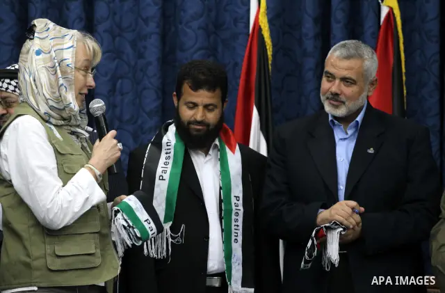 Palestinian Prime Minister in Gaza Strip, Ismail Haniya meets with members of the "Miles of Smiles 3" aid convoy in his office in Gaza city on Jun 20,2011. The convoy, carrying medical aid for the impoverished Palestinia...