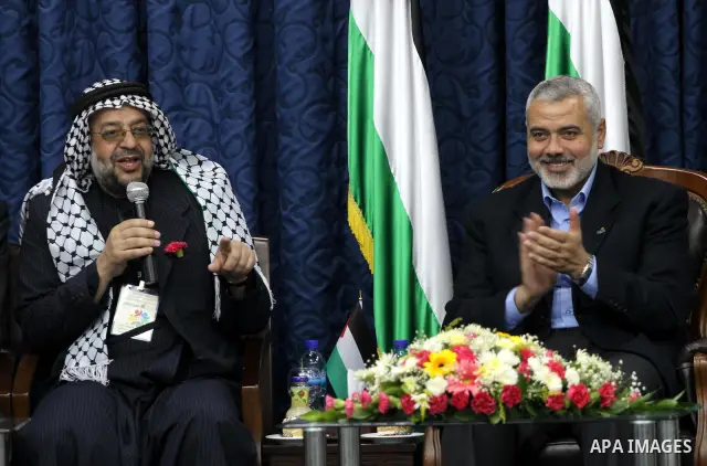 Palestinian Prime Minister in Gaza Strip, Ismail Haniya meets with members of the "Miles of Smiles 3" aid convoy in his office in Gaza city on Jun 20,2011. The convoy, carrying medical aid for the impoverished Palestinia...