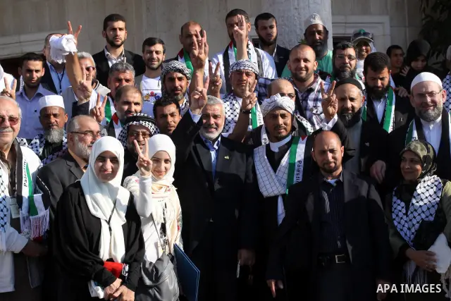 Palestinian Prime Minister in Gaza Strip, Ismail Haniya meets with members of the "Miles of Smiles 3" aid convoy in his office in Gaza city on Jun 20,2011. The convoy, carrying medical aid for the impoverished Palestinia...