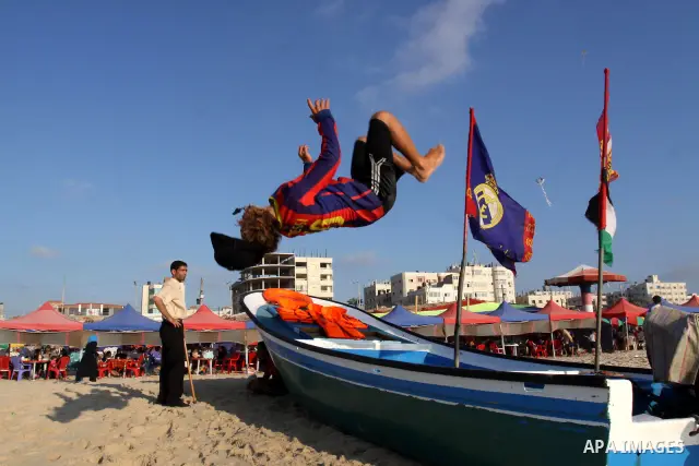 Palestinians enjoy swimming in the sea on Gaza's beach on June 21, 2011 in Gaza City. Photo by Mohammed Asad