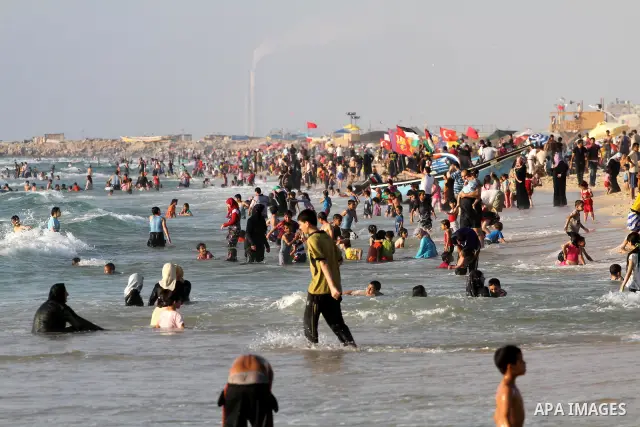 Palestinians enjoy swimming in the sea on Gaza's beach on June 21, 2011 in Gaza City. Photo by Mohammed Asad