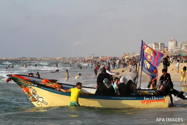 Palestinians enjoy swimming in the sea on Gaza's beach on June 21, 2011 in Gaza City. Photo by Mohammed Asad