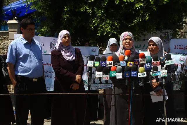 Palestinian Ministry of Women's Affairs display a speech during a press conference about the lack of medicine and demanding for the introduction of medicines in Gaza city on June 22, 2011. Photo by Ashraf amra