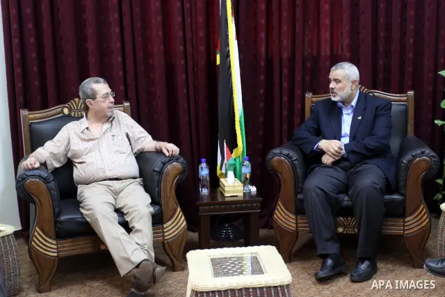 Palestinian Prime Minister in Gaza, Ismail Haniya meets the member of the Political Bureau of the Popular Front, Rabah Muhanna in his office in Gaza city on june 22, 2011. Photo by Mohammed Asad