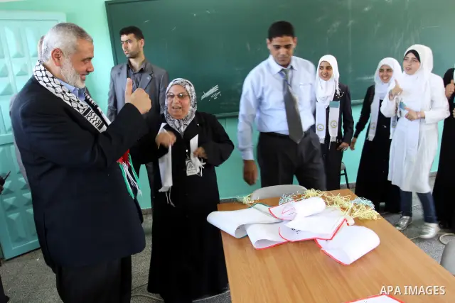 Palestinian prime minister in Gaza Strip, Ismail Haniya attends the opening of the first school in Palestine for deaf students, in Gaza city on Jun 22,2011. Photo by Mohammed Asad