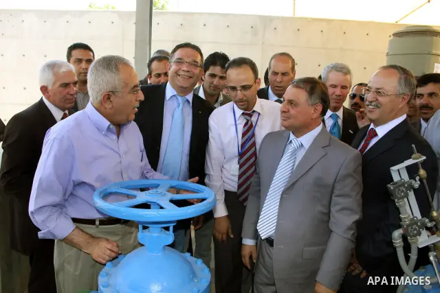 Palestinian prime minister Salam Fayyad attends the inauguration ceremony for well stations rehabilitation project in the southern West Bank village of Tuqu'a, which was financed by the US Agency for international Develo...
