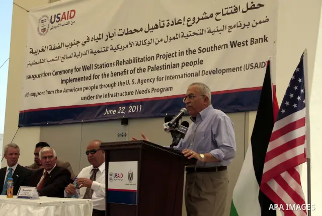 Palestinian prime minister Salam Fayyad delivers a speech during the inauguration ceremony for well stations rehabilitation project in the southern West Bank village of Tuqu'a, which was financed by the US Agency for int...