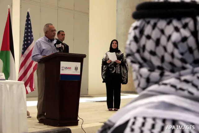 Palestinian prime minister Salam Fayyad delivers a speech during the inauguration ceremony for well stations rehabilitation project in the southern West Bank village of Tuqu'a, which was financed by the US Agency for int...