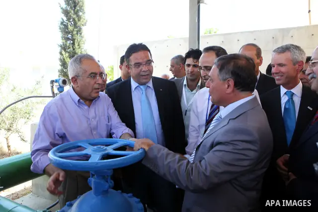 Palestinian prime minister Salam Fayyad attends the inauguration ceremony for well stations rehabilitation project in the southern West Bank village of Tuqu'a, which was financed by the US Agency for international Develo...