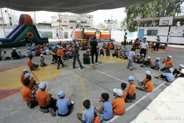 Palestinian boys play at a summer camp organised by UNRWA in Rafah, southern Gaza Strip on Jun 23, 2011. Photo by Abed Rahim Khatib