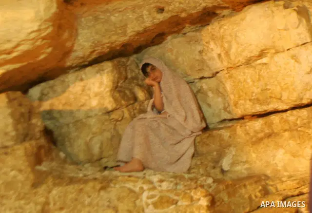 A Palestinian Muslim girl sits inside the Dome of the Rock at the Al-Aqsa Mosques compound in Jerusalem's Old City on Jun 23, 2011. Photo by Mahfouz Abu Turk