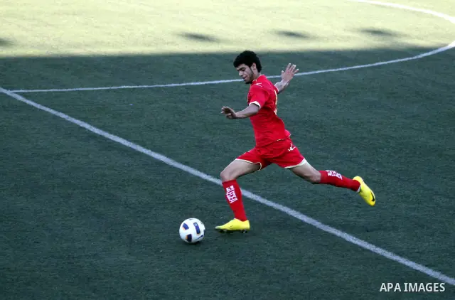 Bahrain's team player kicks the ball in the match between his national team and Palestinian team during their 2012 Olympic qualifying football match in the West Bank town of Al-Ram, near Ramallah, on June 23, 2011 . Phot...