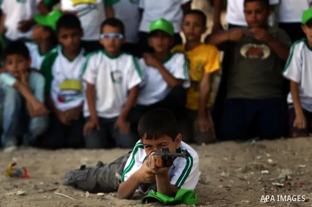 Palestinian boys play at a summer camp organised by the Islamist movement Hamas in Gaza City on June 23, 2011. Photo by Ali Jadallah