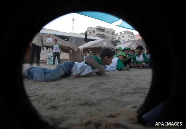 Palestinian boys play at a summer camp organised by the Islamist movement Hamas in Gaza City on June 23, 2011. Photo by Ali Jadallah