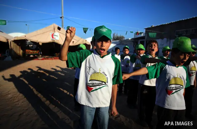 Palestinian boys play at a summer camp organised by the Islamist movement Hamas in Gaza City on June 23, 2011. Photo by Ali Jadallah