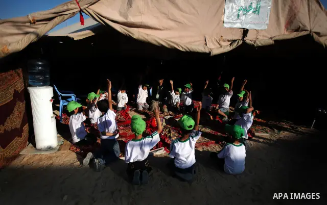 Palestinian boys play at a summer camp organised by the Islamist movement Hamas in Gaza City on June 23, 2011. Photo by Ali Jadallah
