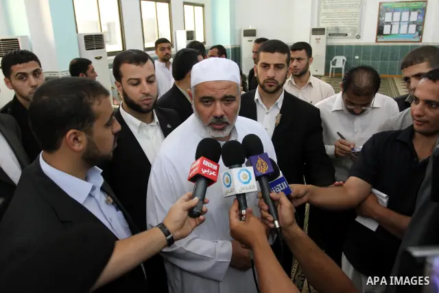 Palestinian prime minister in Gaza Strip, Ismail Haniya speaks to media after his meeting with members of ''Miles of Smiles 3'' aid convoy following Friday prayers at Al-Gharbi mosque in Gaza city on Jun 24,2011.. Photo...