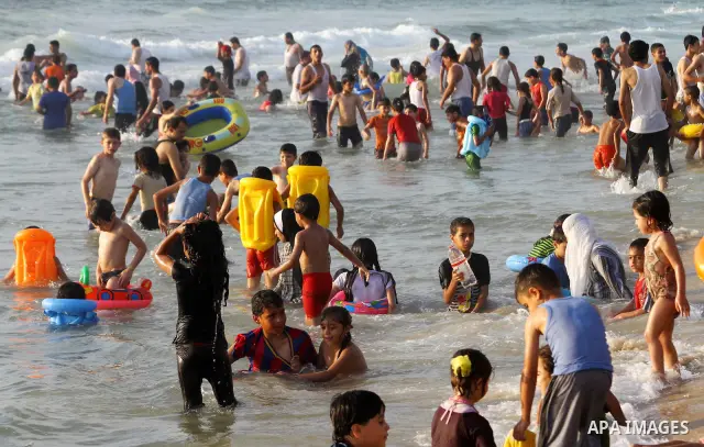 Palestinians enjoy a day at the beach in Gaza City on June 24, 2011. Photo by Ashraf Amra