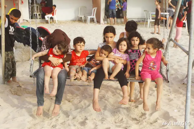 Palestinians enjoy a day at the beach in Gaza City on June 24, 2011. Photo by Ashraf Amra