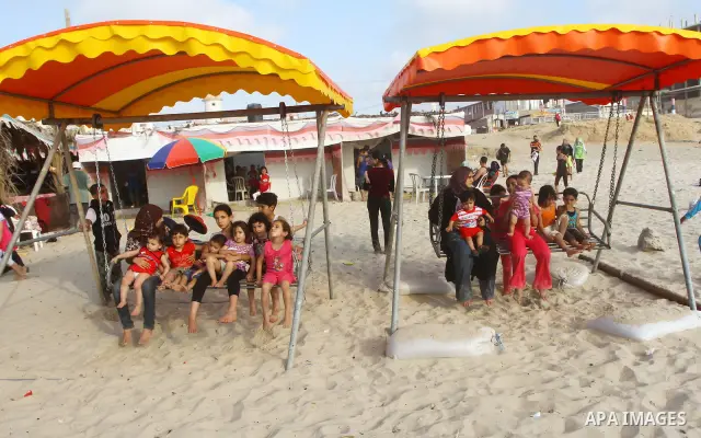 Palestinians enjoy a day at the beach in Gaza City on June 24, 2011. Photo by Ashraf Amra