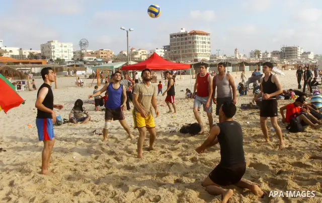 Palestinians enjoy a day at the beach in Gaza City on June 24, 2011. Photo by Ashraf Amra
