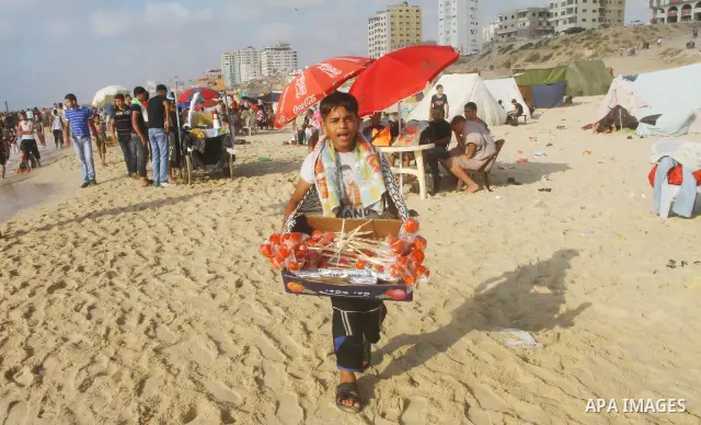 Palestinians enjoy a day at the beach in Gaza City on June 24, 2011. Photo by Ashraf Amra