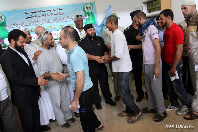 Palestinian prisoners prepare to be freed from a Hamas-run jail in Gaza City on June 25, 2011. Palestinian Hamas policemen released 26 prisoners in the presence of the convoy of "Miles of Smiles 3". Photo by Mohammed Asa...