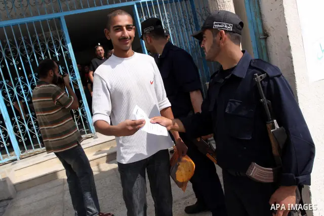 Palestinian prisoners prepare to be freed from a Hamas-run jail in Gaza City on June 25, 2011. Palestinian Hamas policemen released 26 prisoners in the presence of the convoy of "Miles of Smiles 3". Photo by Mohammed Asa...