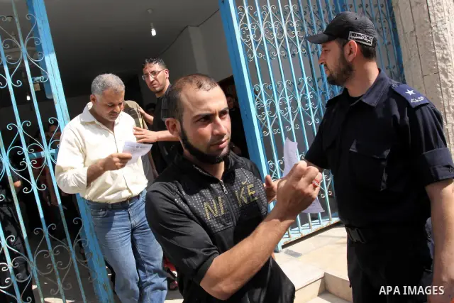 Palestinian prisoners prepare to be freed from a Hamas-run jail in Gaza City on June 25, 2011. Palestinian Hamas policemen released 26 prisoners in the presence of the convoy of "Miles of Smiles 3". Photo by Mohammed Asa...