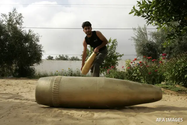 A Palestinian man retains the missiles did not explode in his house as a form of art in the east of Khan Younis in the southern Gaza Strip on June 25, 2011. The Red Cross called on Hamas on 23 June 2011 to provide proof...
