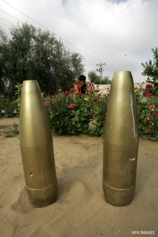 A Palestinian man retains the missiles did not explode in his house as a form of art in the east of Khan Younis in the southern Gaza Strip on June 25, 2011. The Red Cross called on Hamas on 23 June 2011 to provide proof...