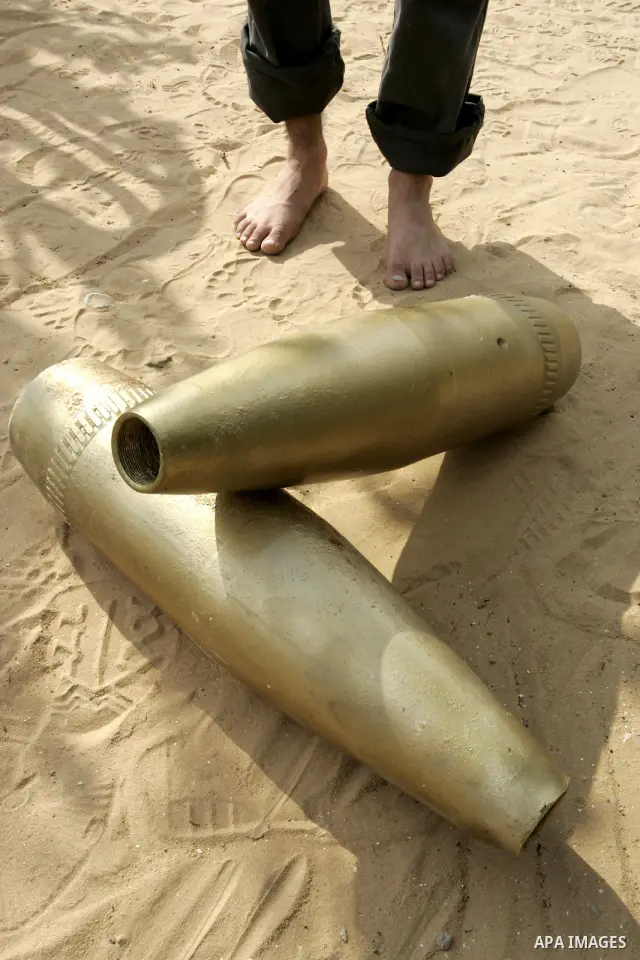 A Palestinian man retains the missiles did not explode in his house as a form of art in the east of Khan Younis in the southern Gaza Strip on June 25, 2011. The Red Cross called on Hamas on 23 June 2011 to provide proof...