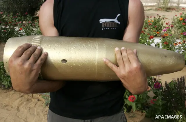 A Palestinian man retains the missiles did not explode in his house as a form of art in the east of Khan Younis in the southern Gaza Strip on June 25, 2011. The Red Cross called on Hamas on 23 June 2011 to provide proof...