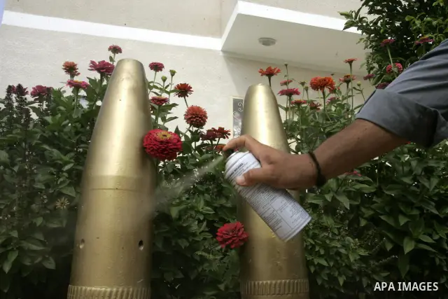 A Palestinian man retains the missiles did not explode in his house as a form of art in the east of Khan Younis in the southern Gaza Strip on June 25, 2011. The Red Cross called on Hamas on 23 June 2011 to provide proof...