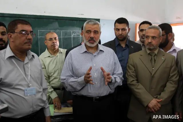 Palestinian Prime Minister in Gaza Strip, Ismail Haniya inspects teachers during correcting the papers of the high school exams known as "Tawjihi" , in Gaza City on June 25, 2011. Photo by Mohammed Asad