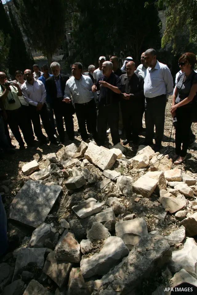 Palestinians and Israeli Arab kenaset members take a part in a protest to the Israeli violations of the Islamic sanctities in Jerusalem on June 27, 2011. where washed away and destroyed yesterday about 100 grave in "Maam...