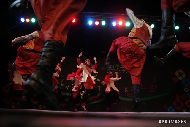 Palestinian dancers from the Wishah Popular Dance Troupe perform the festival "nights of Birzeit" at Birzeit University in the West Bank city of Ramallah on June 28, 2011. Photo by Issam Rimawi