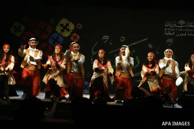 Palestinian dancers from the Wishah Popular Dance Troupe perform the festival "nights of Birzeit" at Birzeit University in the West Bank city of Ramallah on June 28, 2011. Photo by Issam Rimawi