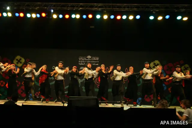 Palestinian dancers from the Wishah Popular Dance Troupe perform the festival "nights of Birzeit" at Birzeit University in the West Bank city of Ramallah on June 28, 2011. Photo by Issam Rimawi