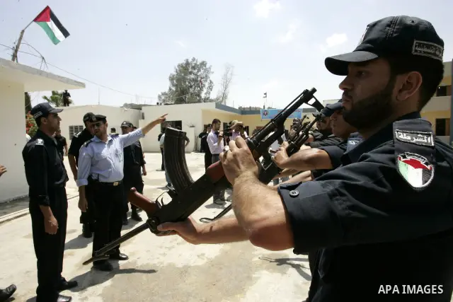 Palestinian Hamas security forces stand guard during opening the headquarters of the new Palestinian police, which was rebuilt after destroyed in the Israeli war on Gaza in 2008-2009 in Rafah, southern Gaza Strip on June...